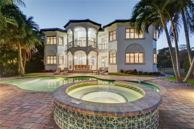 a view of a swimming pool with a house