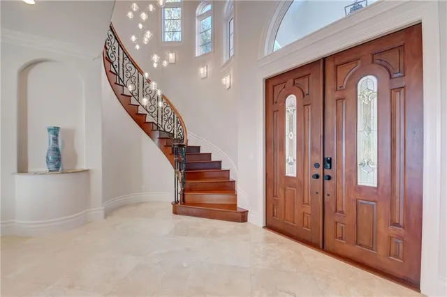 a view of entryway and hall with a front door
