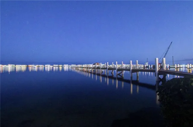 a view of a house with swimming pool and porch
