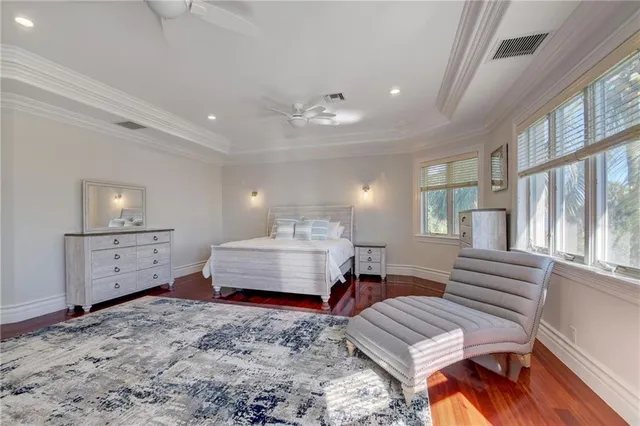 a view of a hallway view with wooden floor and staircase