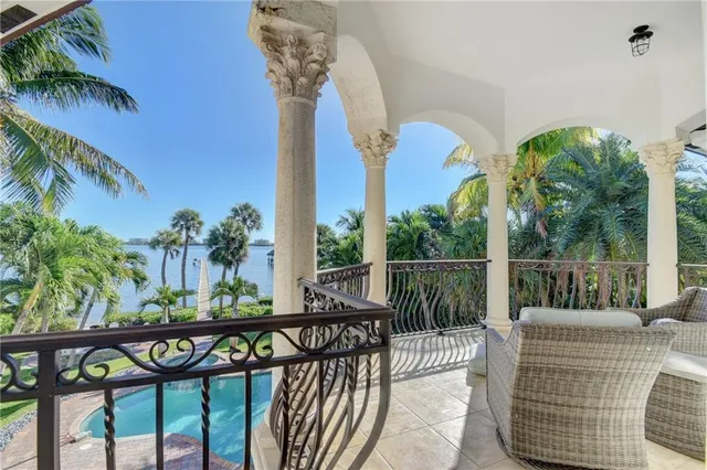 a building outdoor space with patio furniture and potted plants