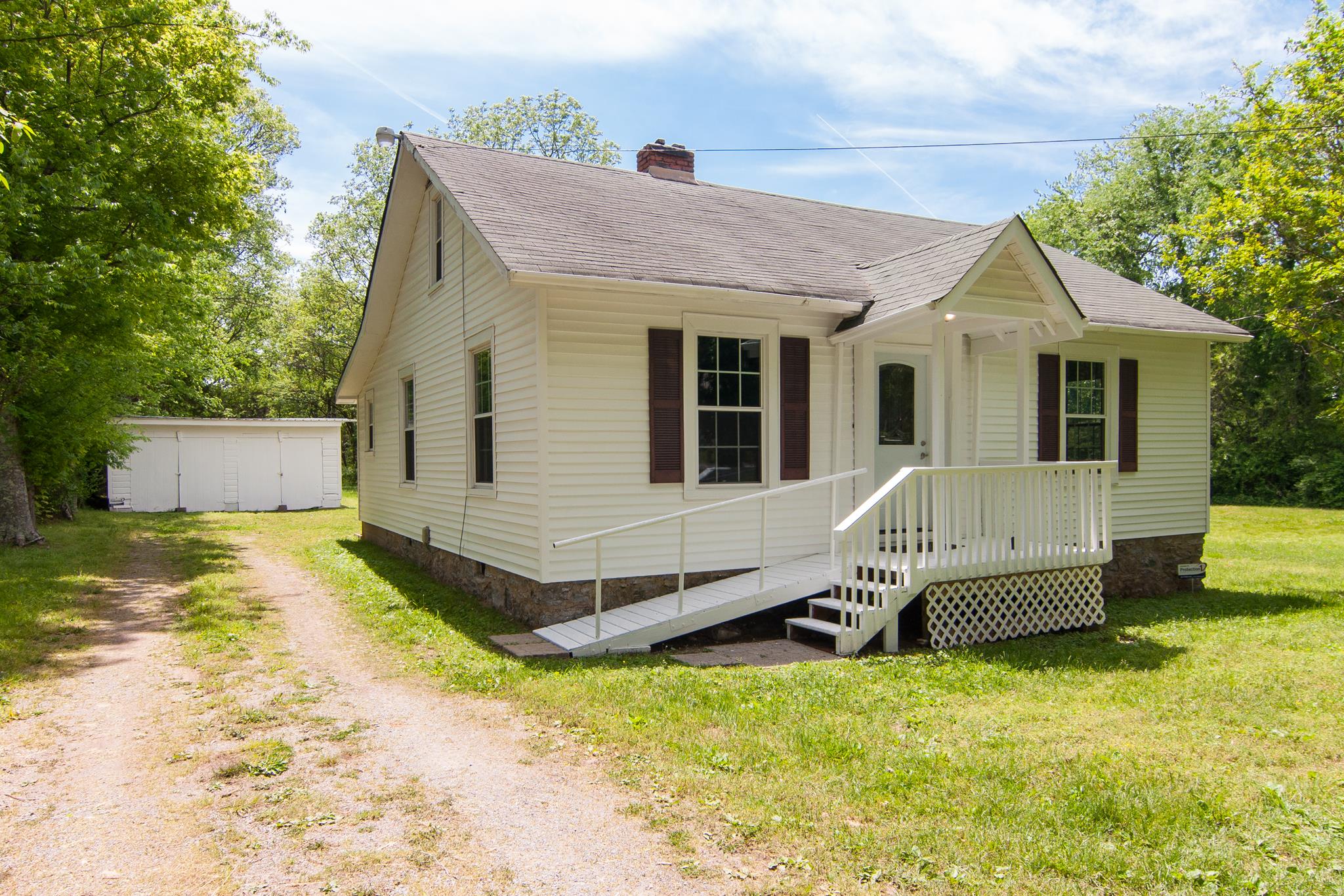4455 Cato Road Nashville, TN 37218 - Photo 2 of 30 The home has vinyl siding that appears in good condition and the rest of the house/garage has been painted.