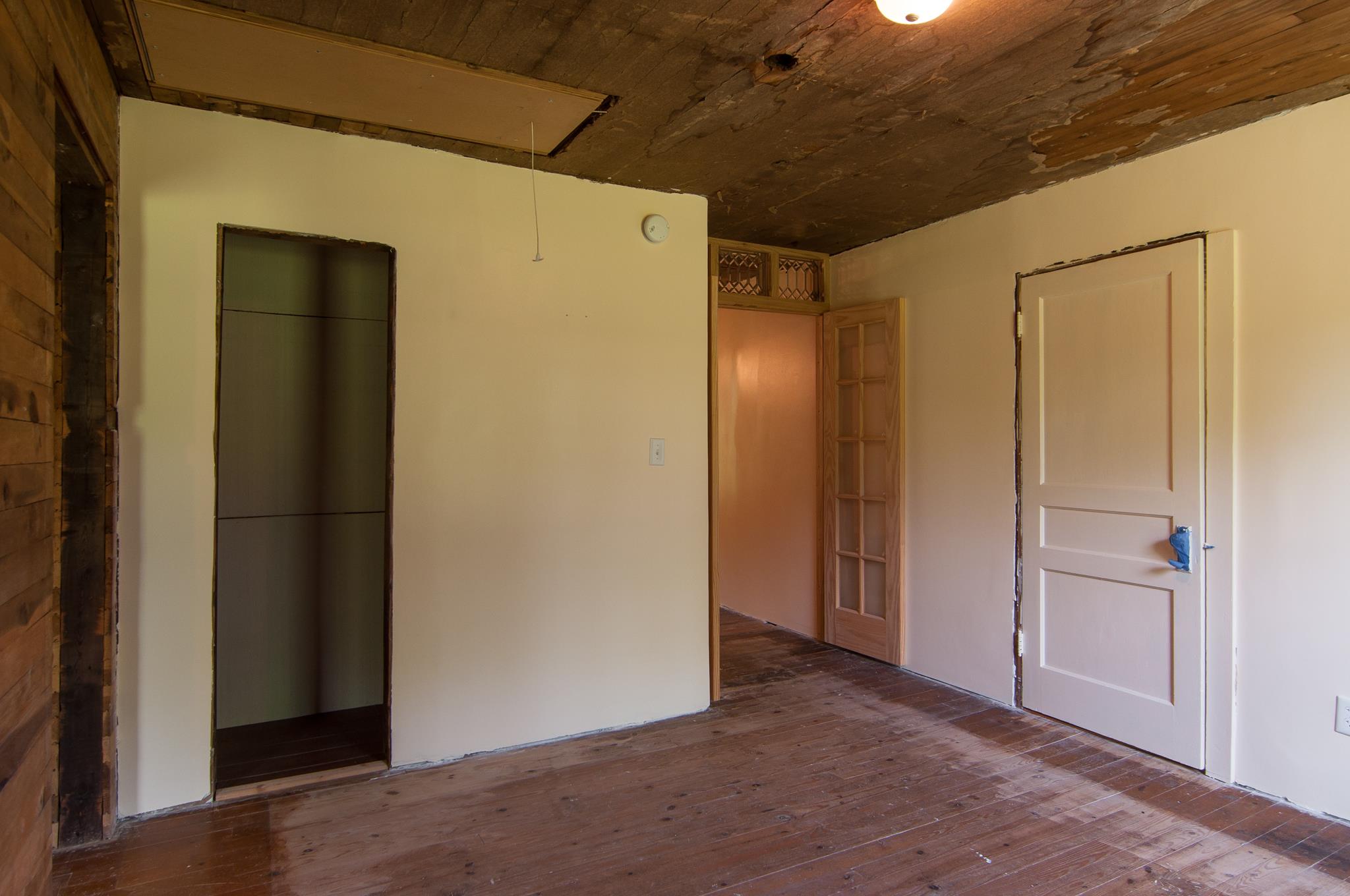 4455 Cato Road Nashville, TN 37218 - Photo 9 of 30 The rear bedroom has been partially sheetrocked,new French doors added. The door to the right leads to a room that would be great as an office/nursery/crafts room or converted to a second bath.