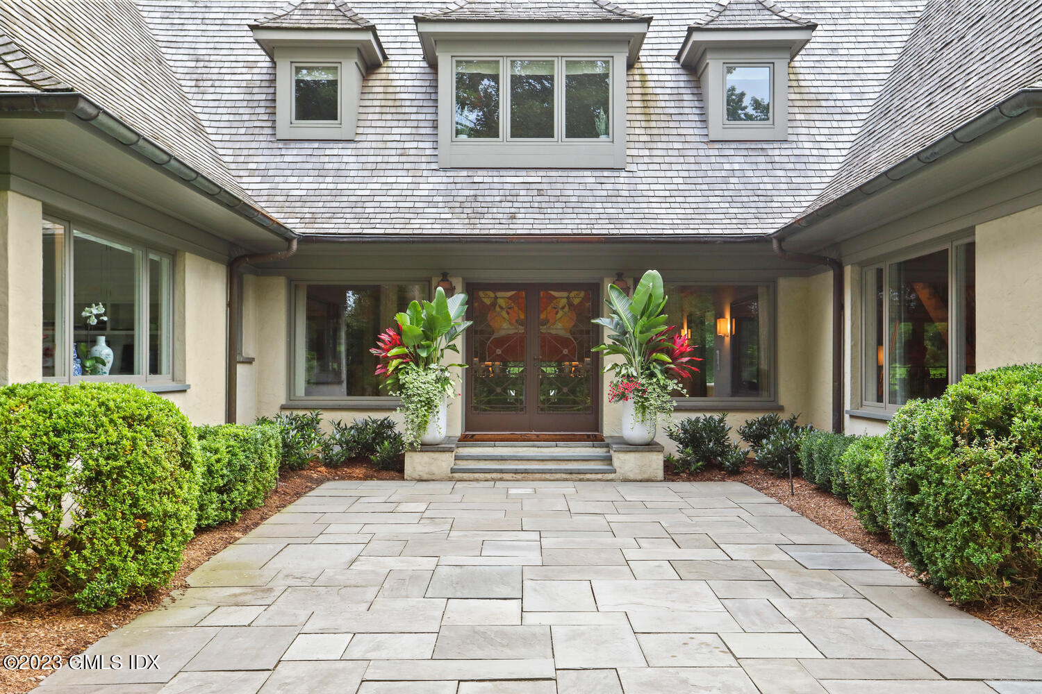 101 Perkins Road Greenwich, CT 06830 - Photo 1 of 41 a front view of a house with garden