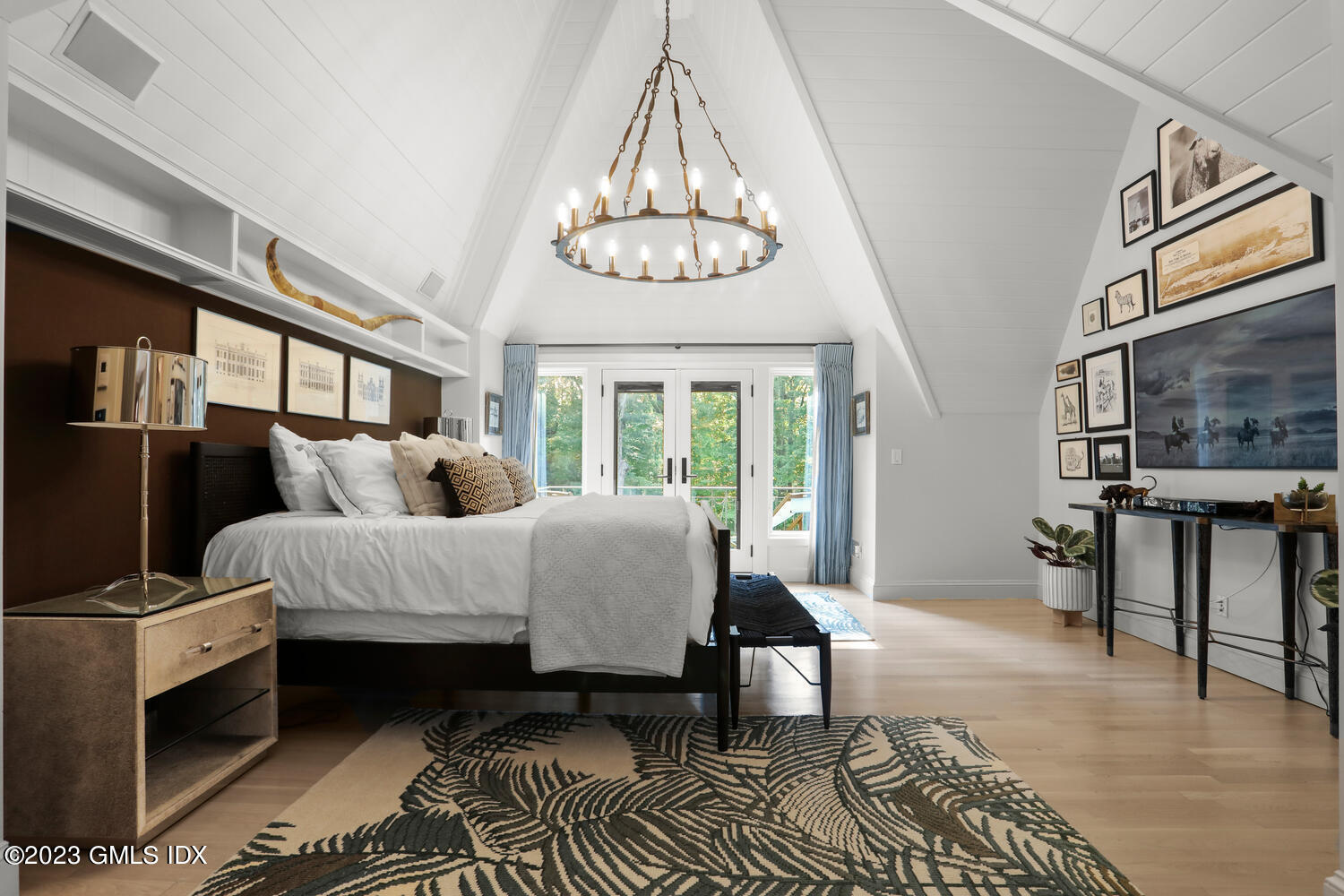 101 Perkins Road Greenwich, CT 06830 - Photo 14 of 41 a bed room with furniture and a chandelier