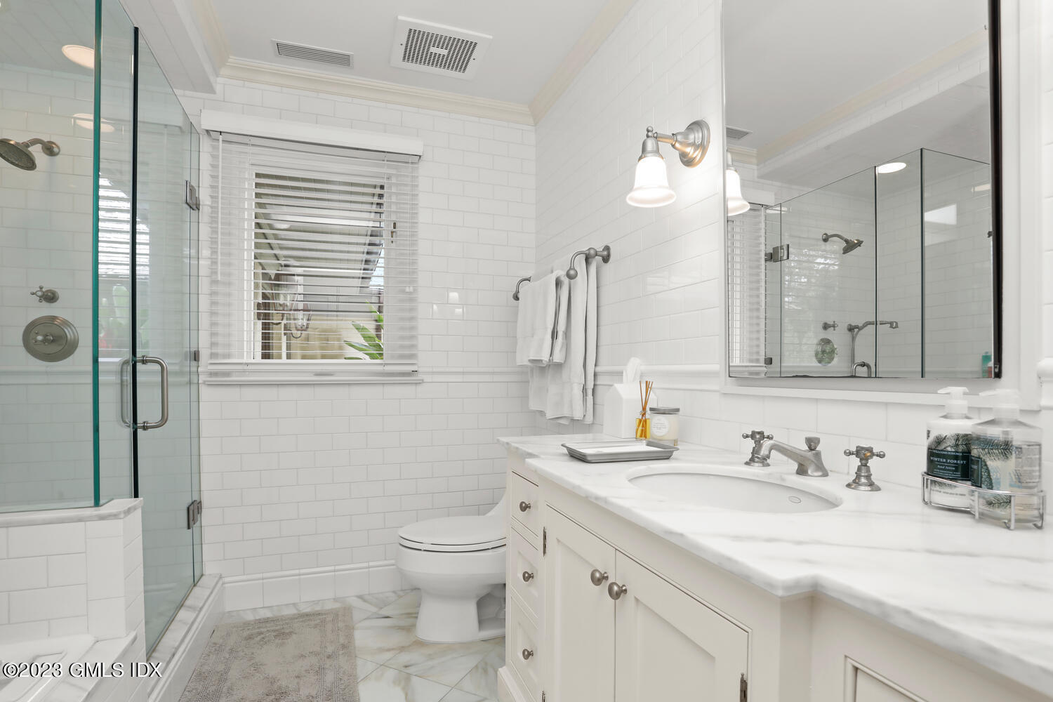 101 Perkins Road Greenwich, CT 06830 - Photo 25 of 41 a bathroom with a granite countertop sink toilet and shower