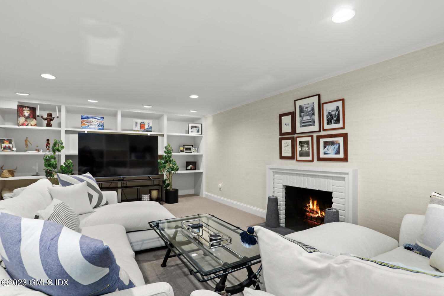 101 Perkins Road Greenwich, CT 06830 - Photo 28 of 41 a living room with furniture a flat screen tv and a fireplace