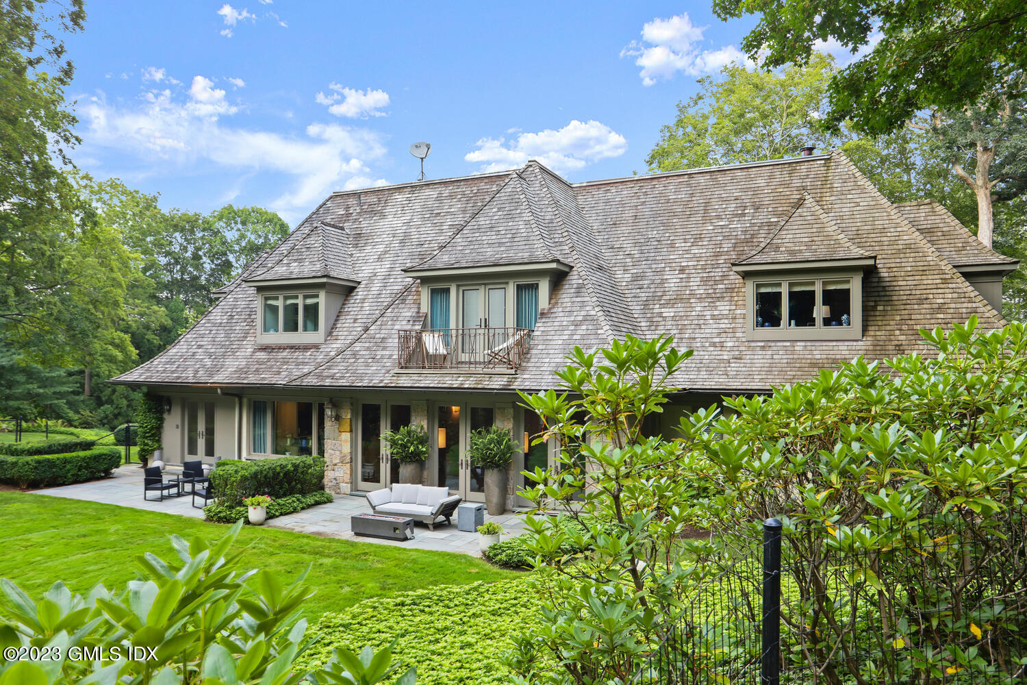 101 Perkins Road Greenwich, CT 06830 - Photo 29 of 41 a front view of a house with garden and porch