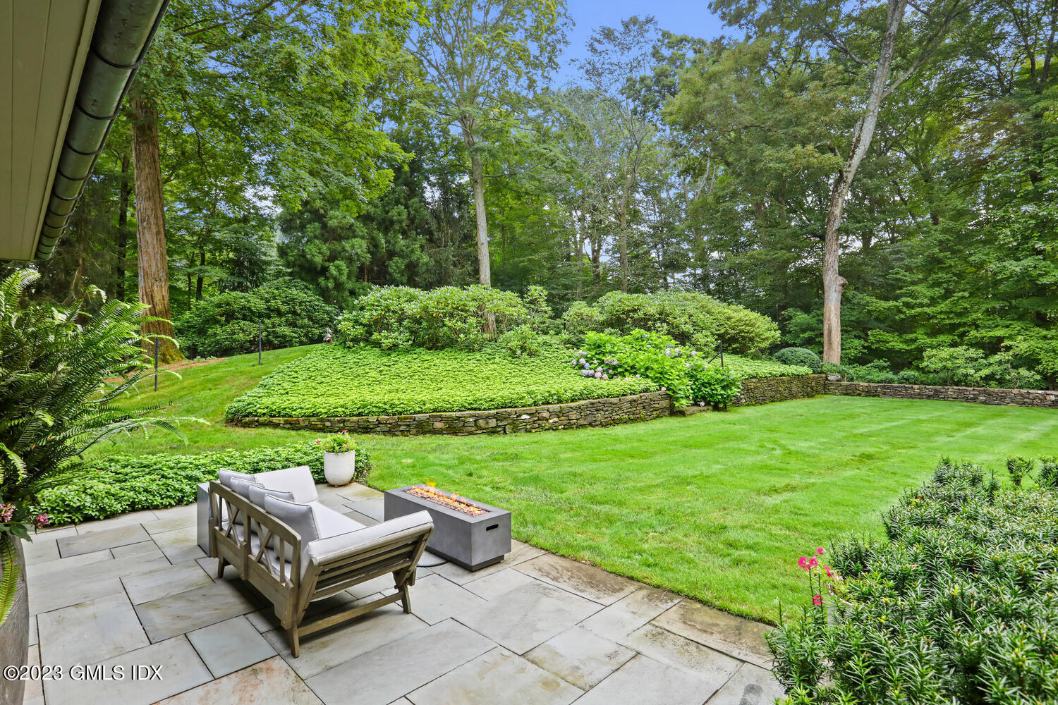 101 Perkins Road Greenwich, CT 06830 - Photo 31 of 41 a view of a backyard with sitting area
