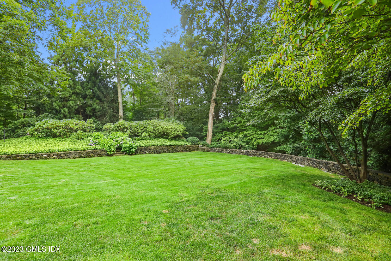 101 Perkins Road Greenwich, CT 06830 - Photo 32 of 41 a view of a lush green space