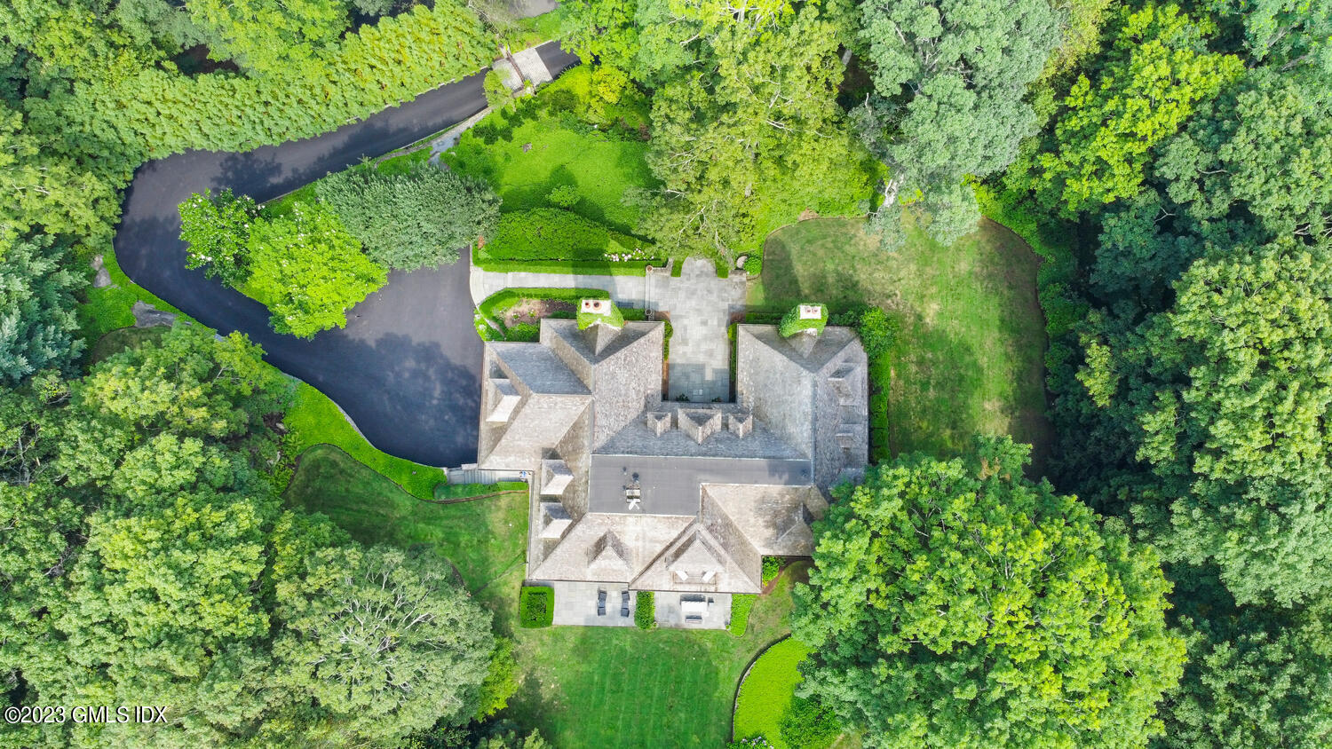 101 Perkins Road Greenwich, CT 06830 - Photo 38 of 41 an aerial view of a house with a yard basket ball court and outdoor seating