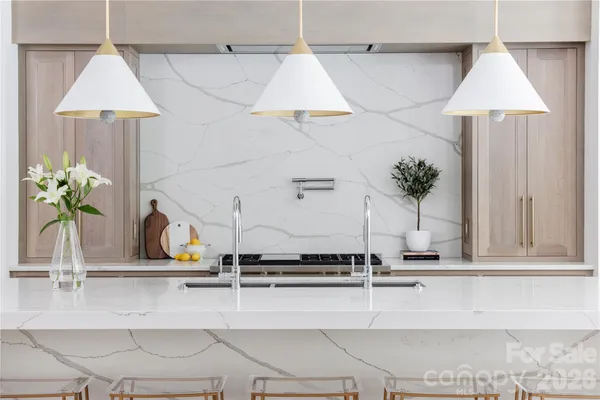 a view of a faucet a sink and a table in it