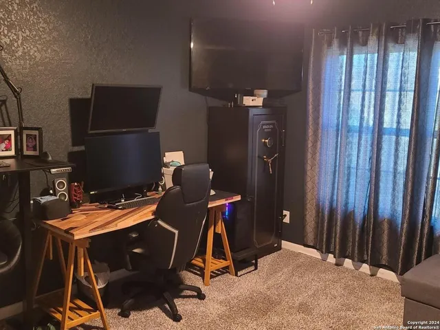 a room with furniture and musical instruments