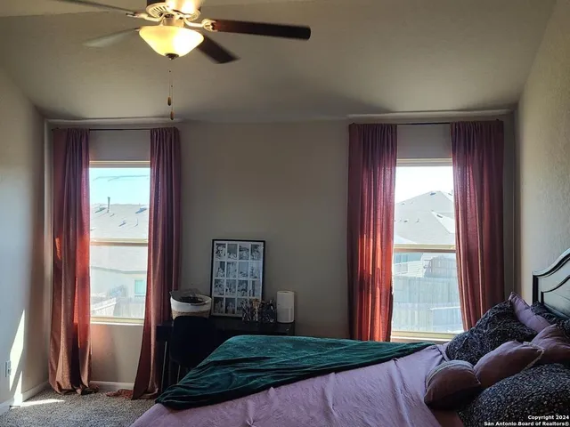 a view of a house with a backyard and a patio