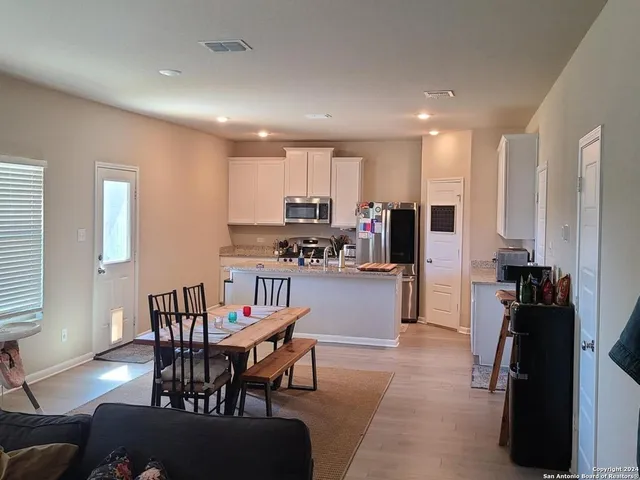a view of a dining room with furniture