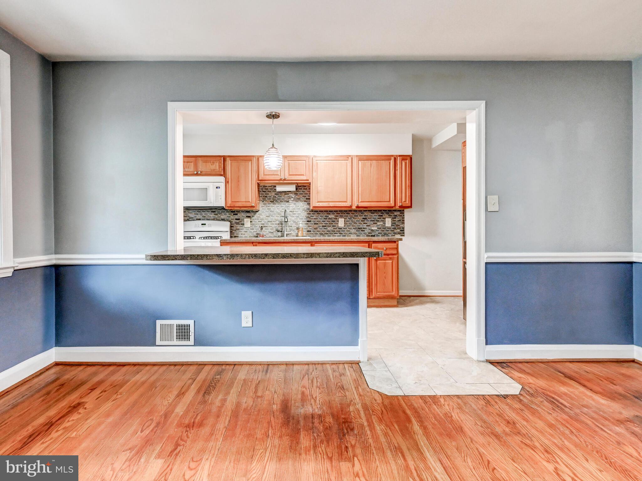 1636 Thetford Road Baltimore, MD 21286 - Photo 10 of 40 a view of a kitchen with a sink and wooden floor
