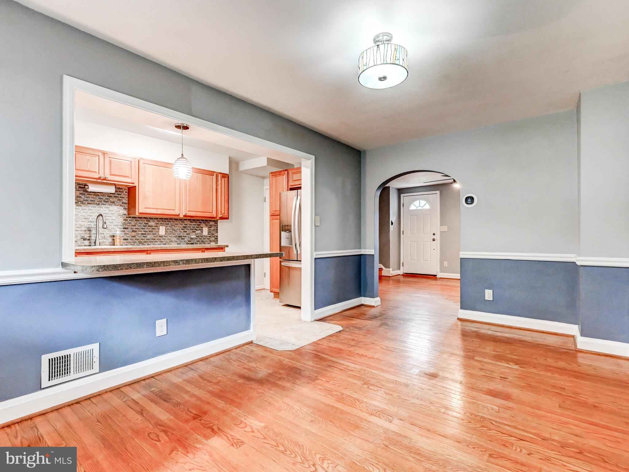 1636 Thetford Road Baltimore, MD 21286 - Photo 11 of 40 a view of an empty room with window and wooden floor