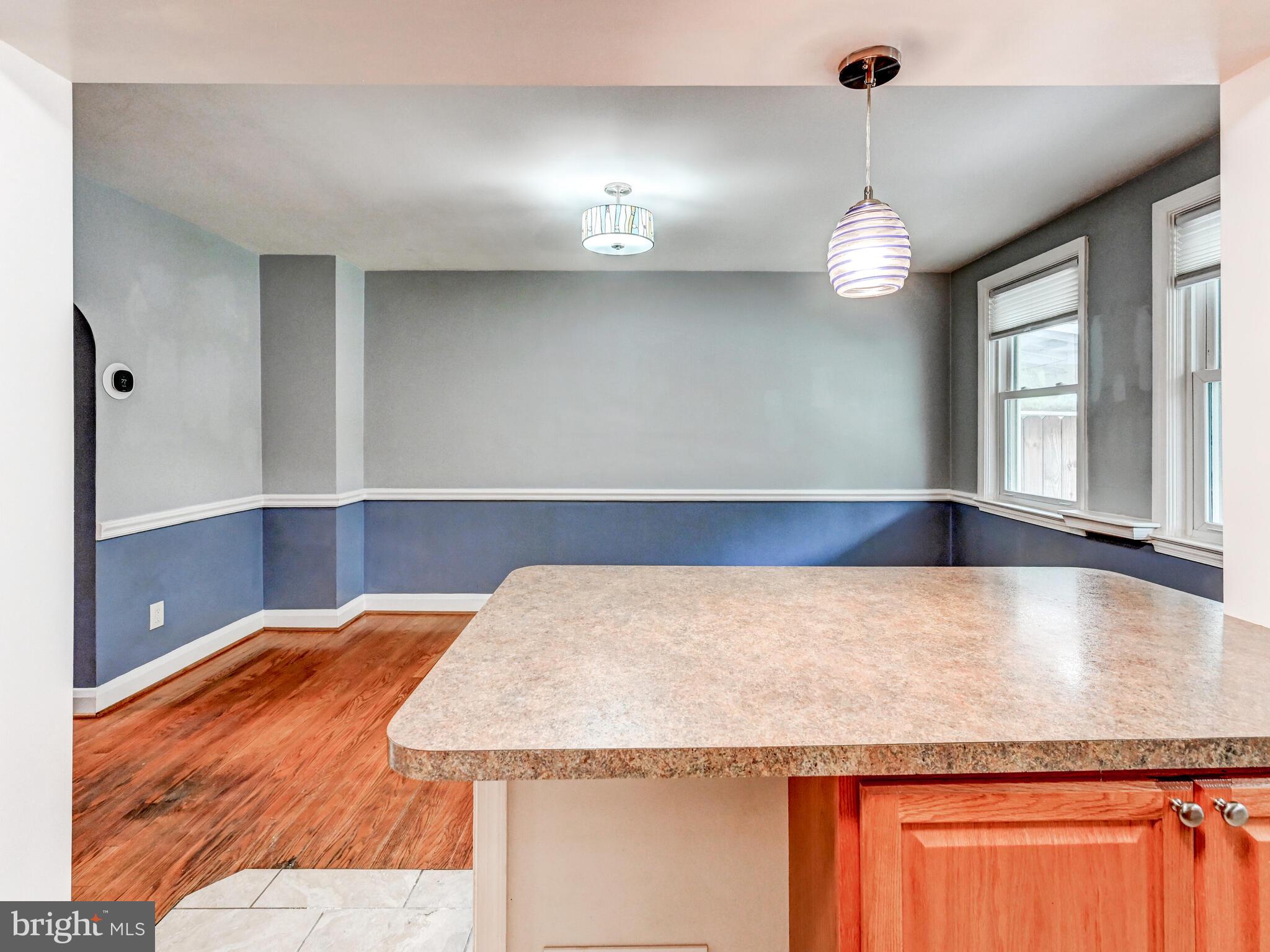 1636 Thetford Road Baltimore, MD 21286 - Photo 14 of 40 a view of a kitchen with granite countertop a sink and dishwasher with wooden floor