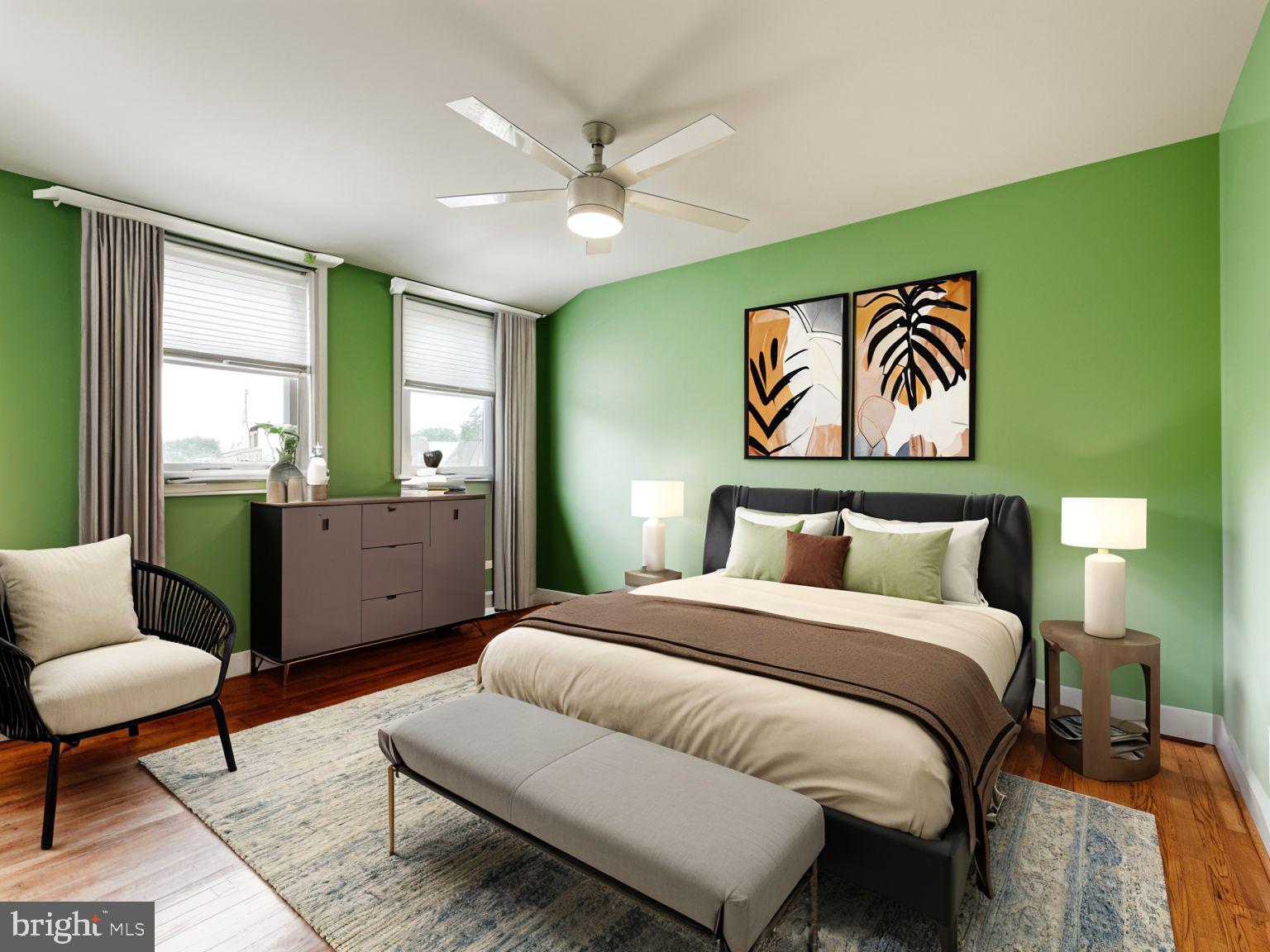 1636 Thetford Road Baltimore, MD 21286 - Photo 19 of 40 a spacious bedroom with a bed a couch and a window