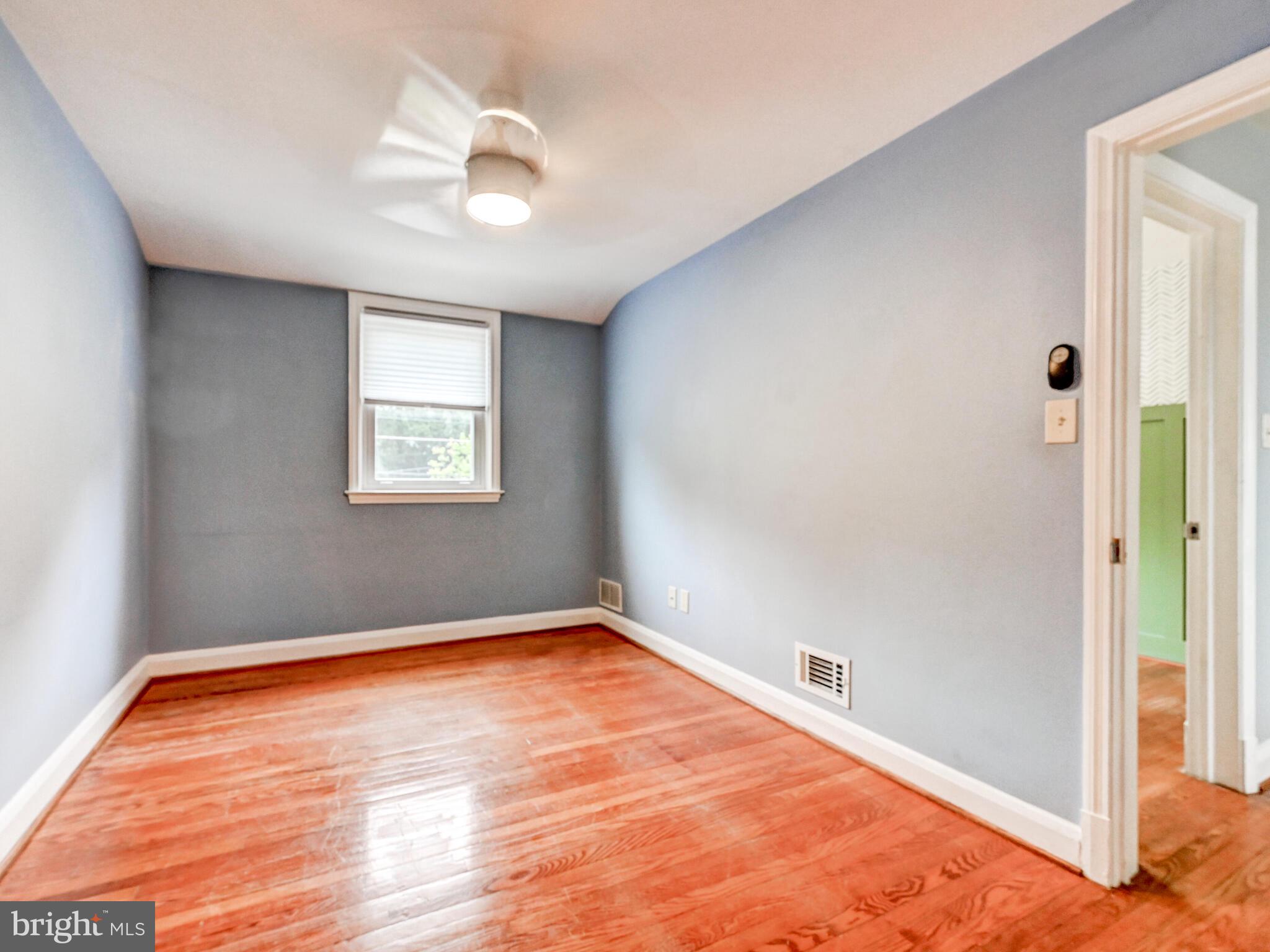 1636 Thetford Road Baltimore, MD 21286 - Photo 20 of 40 a view of empty room with wooden floor and fan