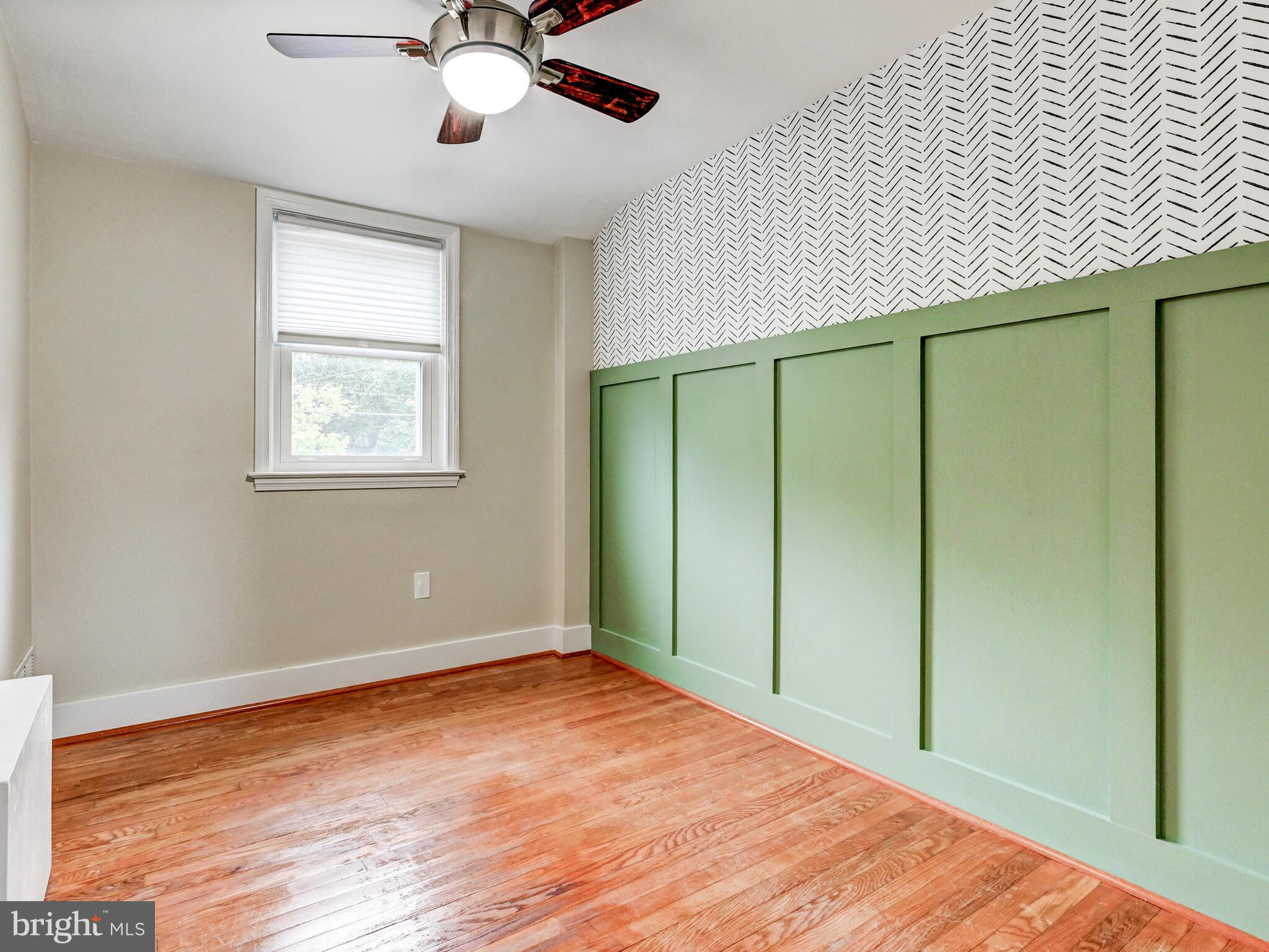 1636 Thetford Road Baltimore, MD 21286 - Photo 22 of 40 a view of an empty room with wooden floor and a window