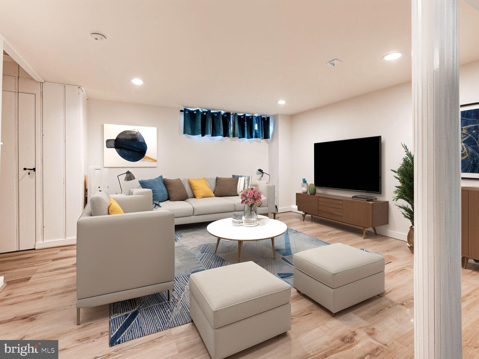 1636 Thetford Road Baltimore, MD 21286 - Photo 27 of 40 a living room with furniture and a flat screen tv