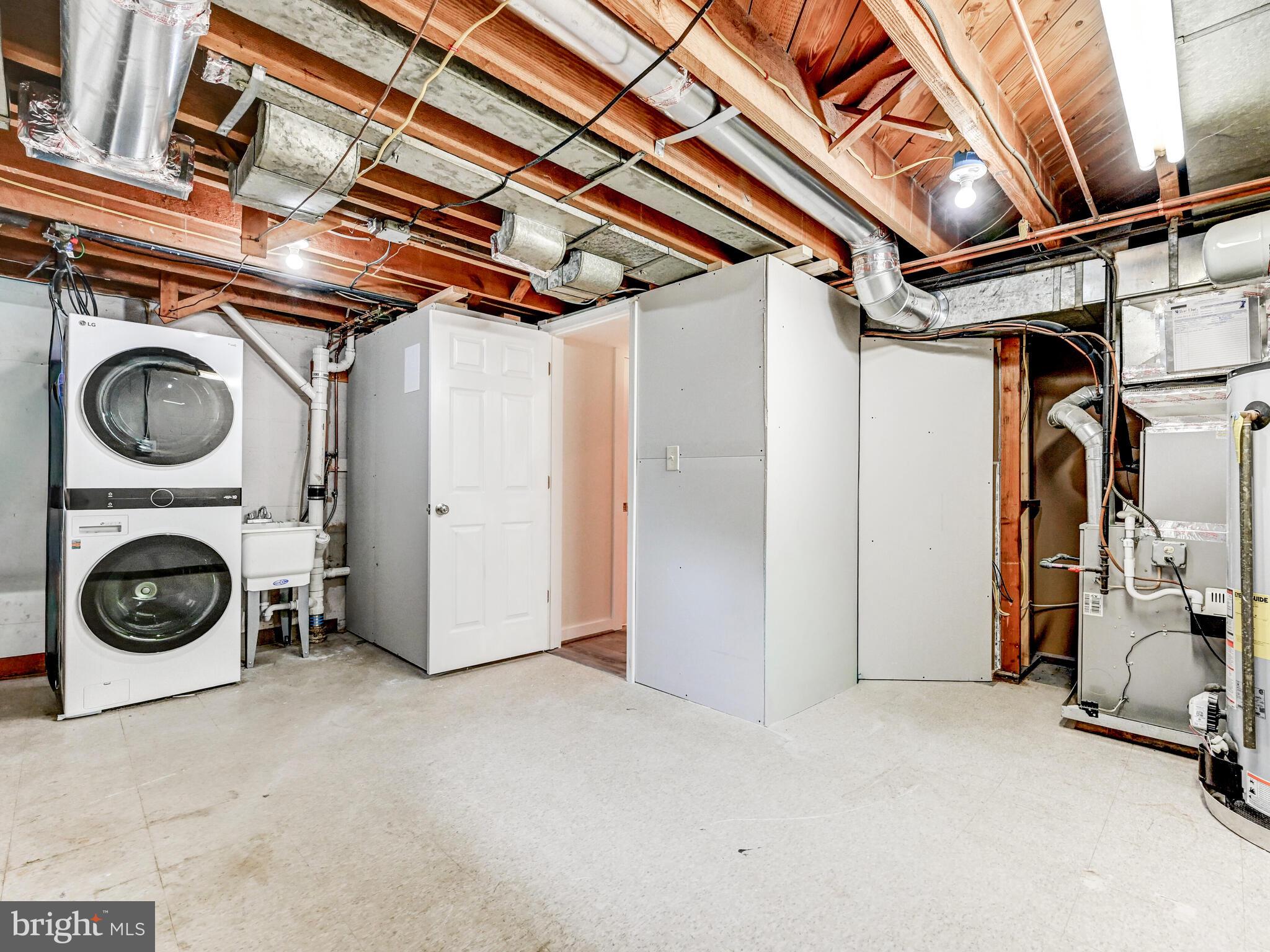 1636 Thetford Road Baltimore, MD 21286 - Photo 31 of 40 a view of a storage & utility room with washer and dryer