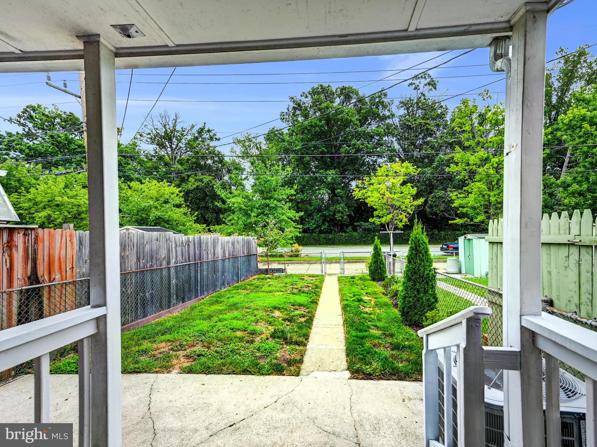 1636 Thetford Road Baltimore, MD 21286 - Photo 32 of 40 a view of a backyard with plants and large trees
