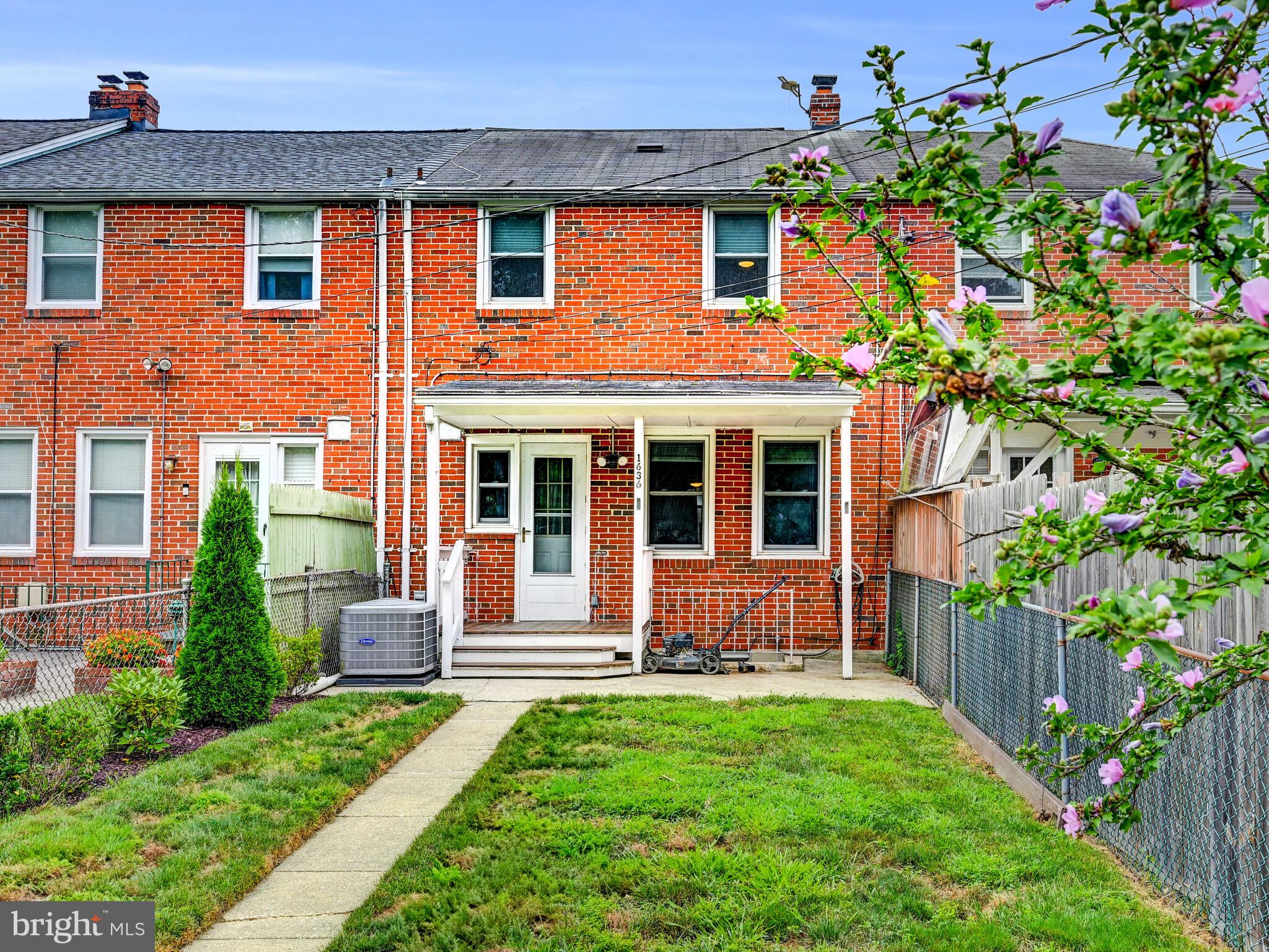 1636 Thetford Road Baltimore, MD 21286 - Photo 34 of 40 a front view of a house with a yard