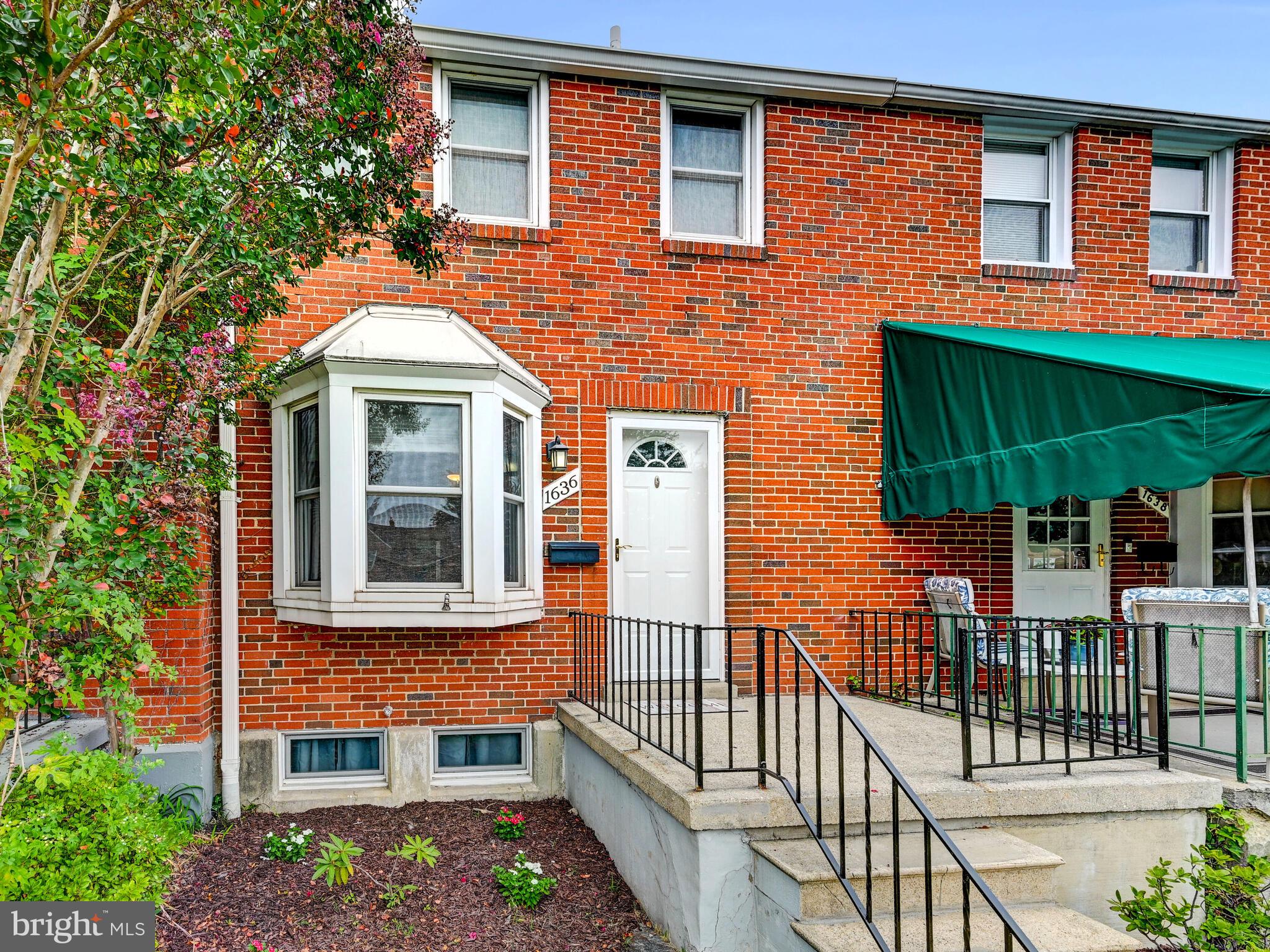 1636 Thetford Road Baltimore, MD 21286 - Photo 4 of 40 a front view of a house with glass windows and plants