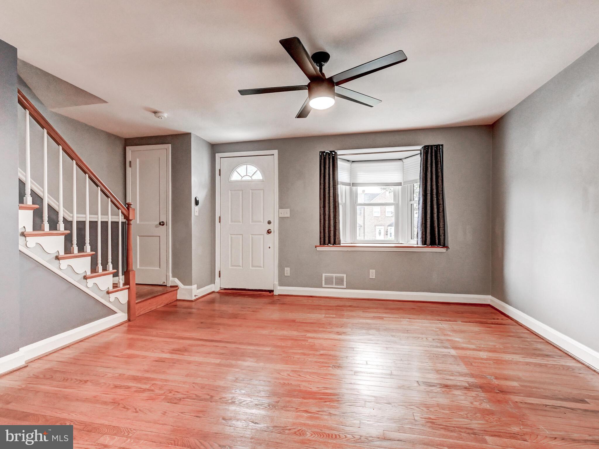 1636 Thetford Road Baltimore, MD 21286 - Photo 7 of 40 a view of an empty room with wooden floor and a window