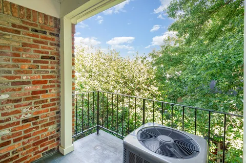 a view of a balcony with an outdoor space