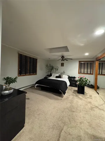 a room with furniture and a flat screen tv
