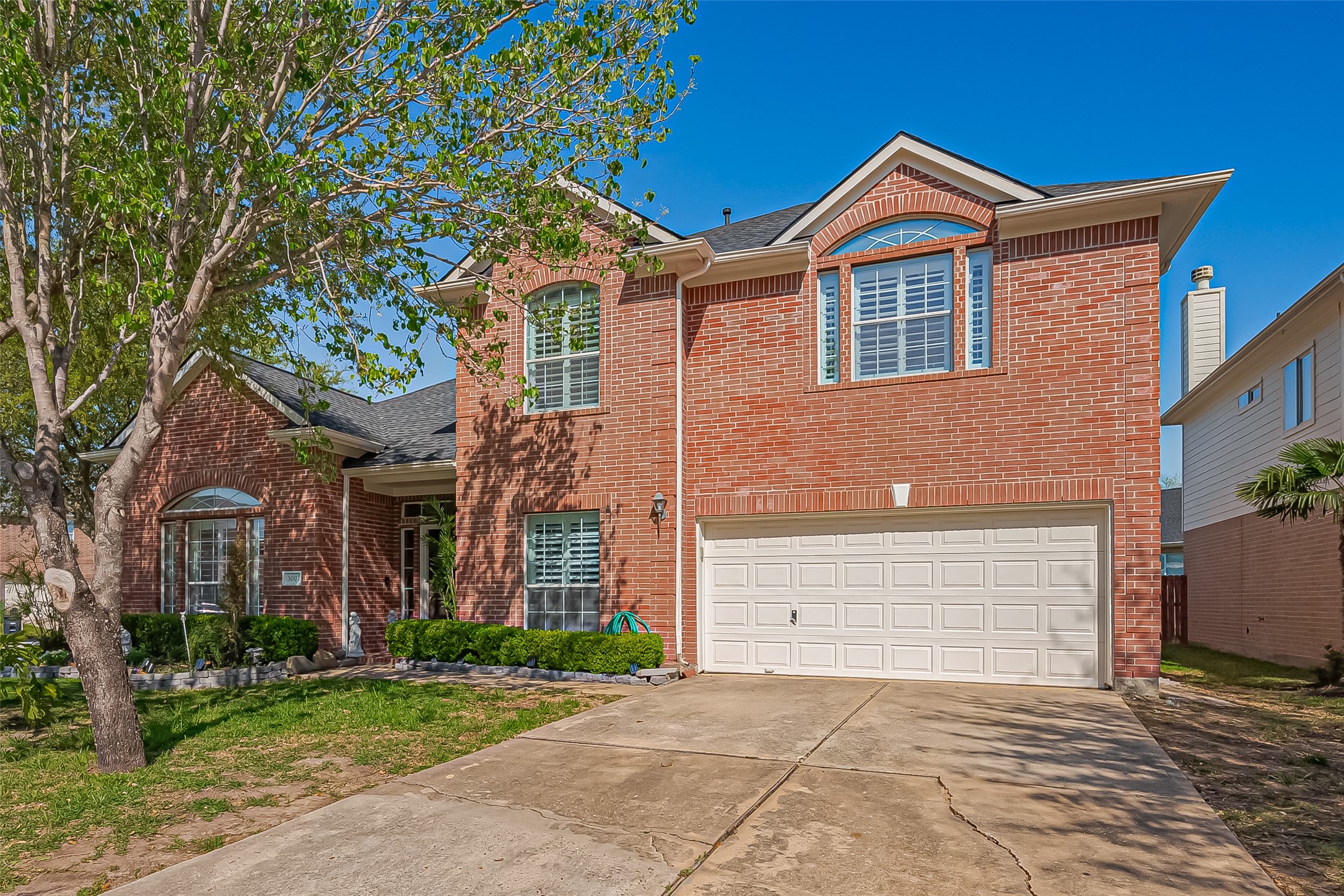 3007 Country Boy Court Spring, TX 77373 - Photo 2 of 31 a front view of a house with a garden