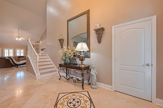 a view of a hallway with seating area