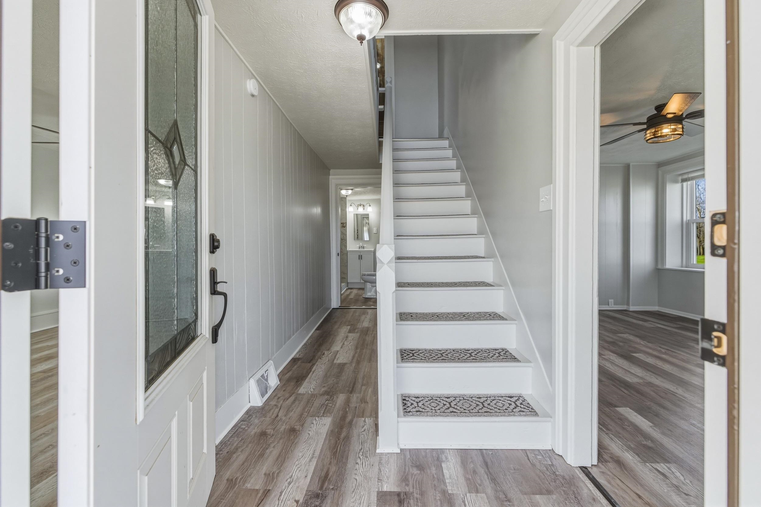 773 West Main Street Stanley, VA 22851 - Photo 14 of 66 a view of a hallway with wooden floor and staircase