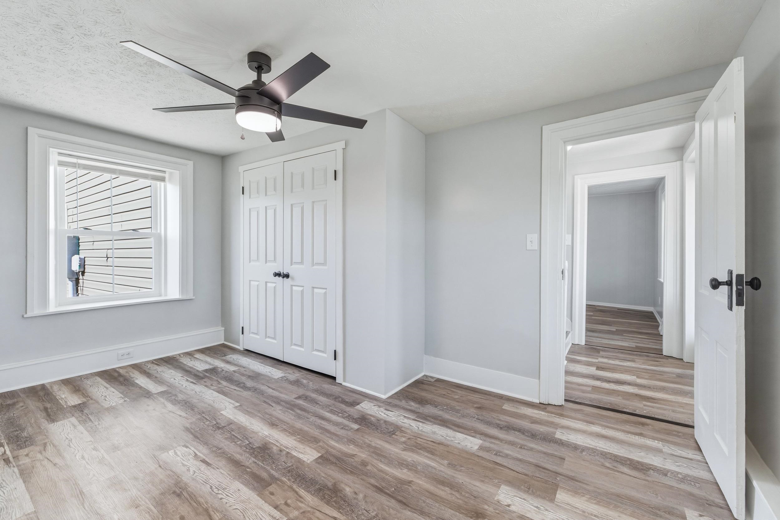 773 West Main Street Stanley, VA 22851 - Photo 17 of 66 wooden floor in an empty room with a window