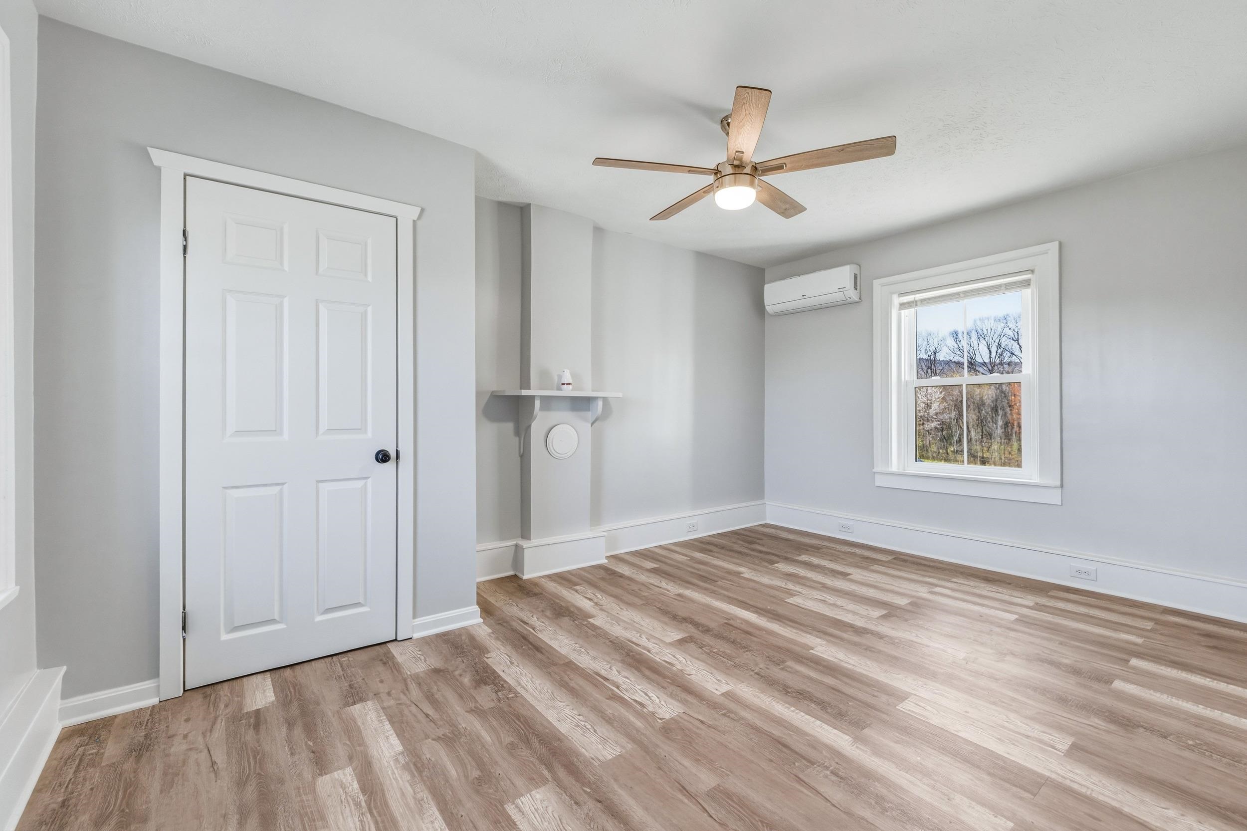 773 West Main Street Stanley, VA 22851 - Photo 21 of 66 a view of empty room with wooden floor and fan