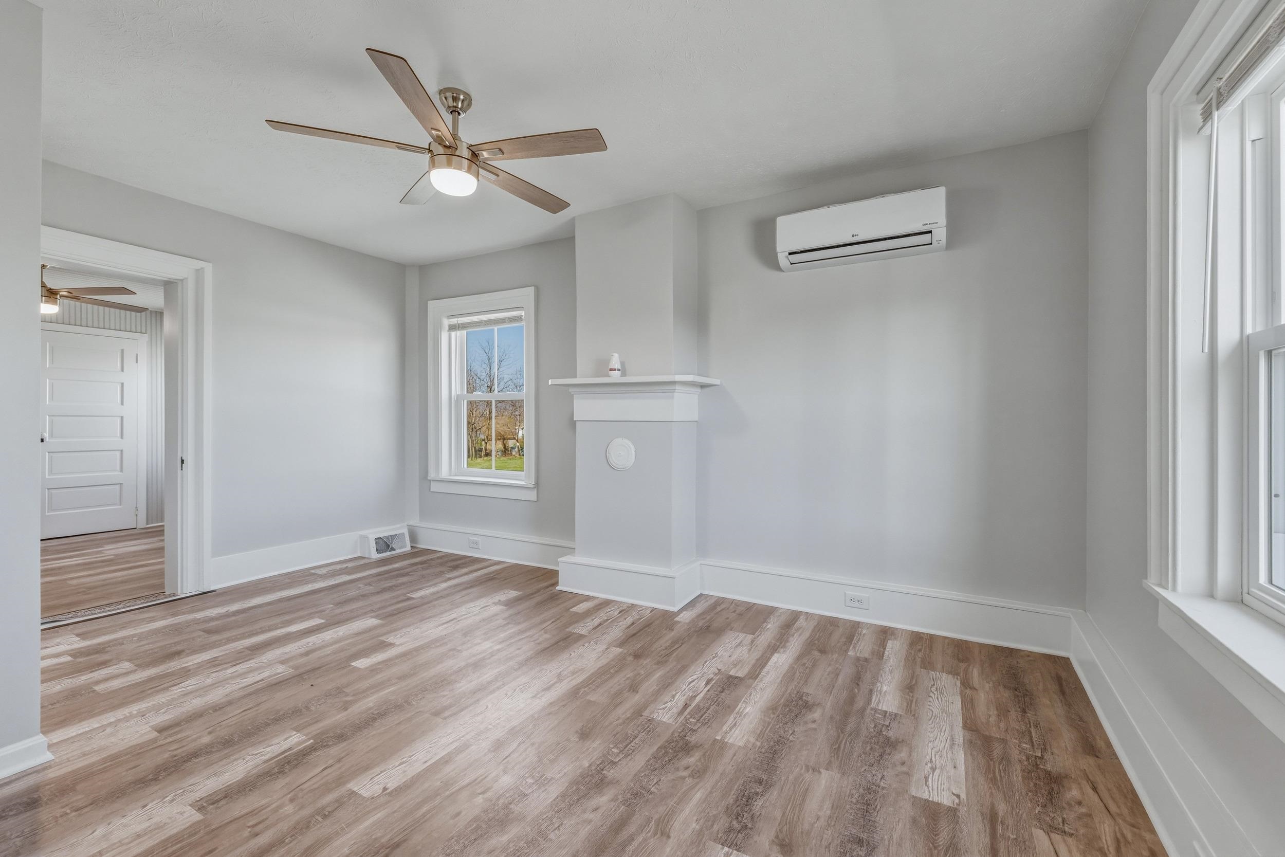 773 West Main Street Stanley, VA 22851 - Photo 24 of 66 wooden floor in an empty room with a window