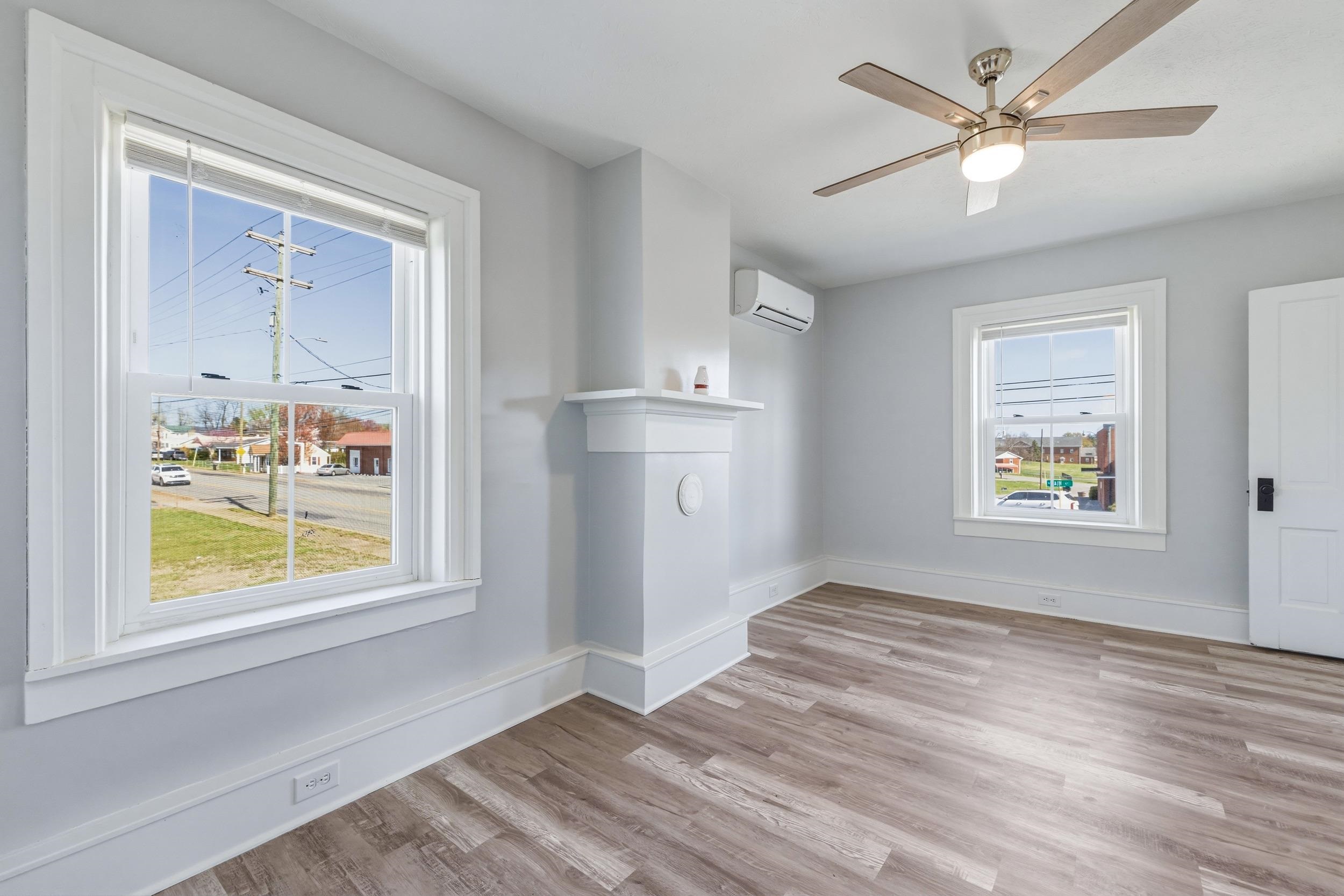 773 West Main Street Stanley, VA 22851 - Photo 26 of 66 wooden floor in an empty room with a window