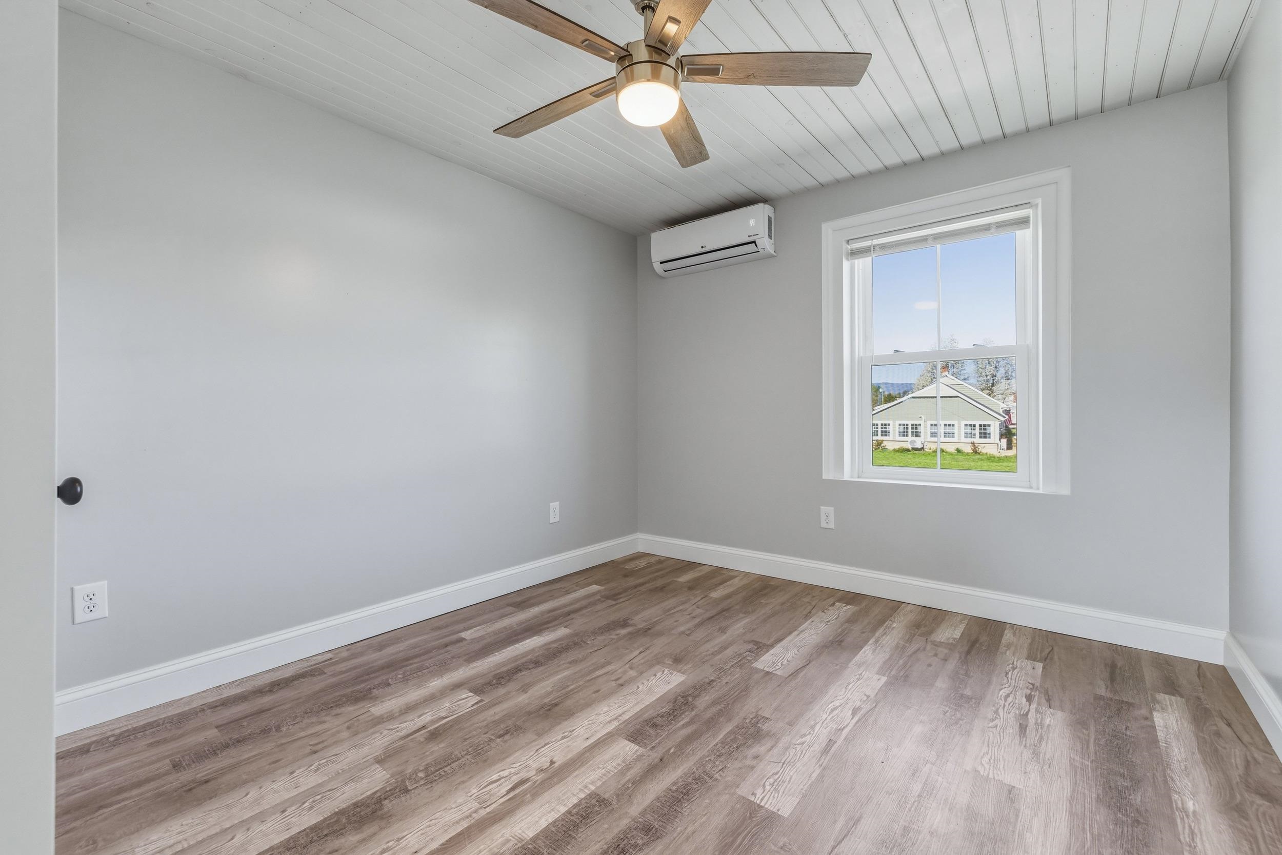 773 West Main Street Stanley, VA 22851 - Photo 29 of 66 an empty room with a window and a ceiling fan