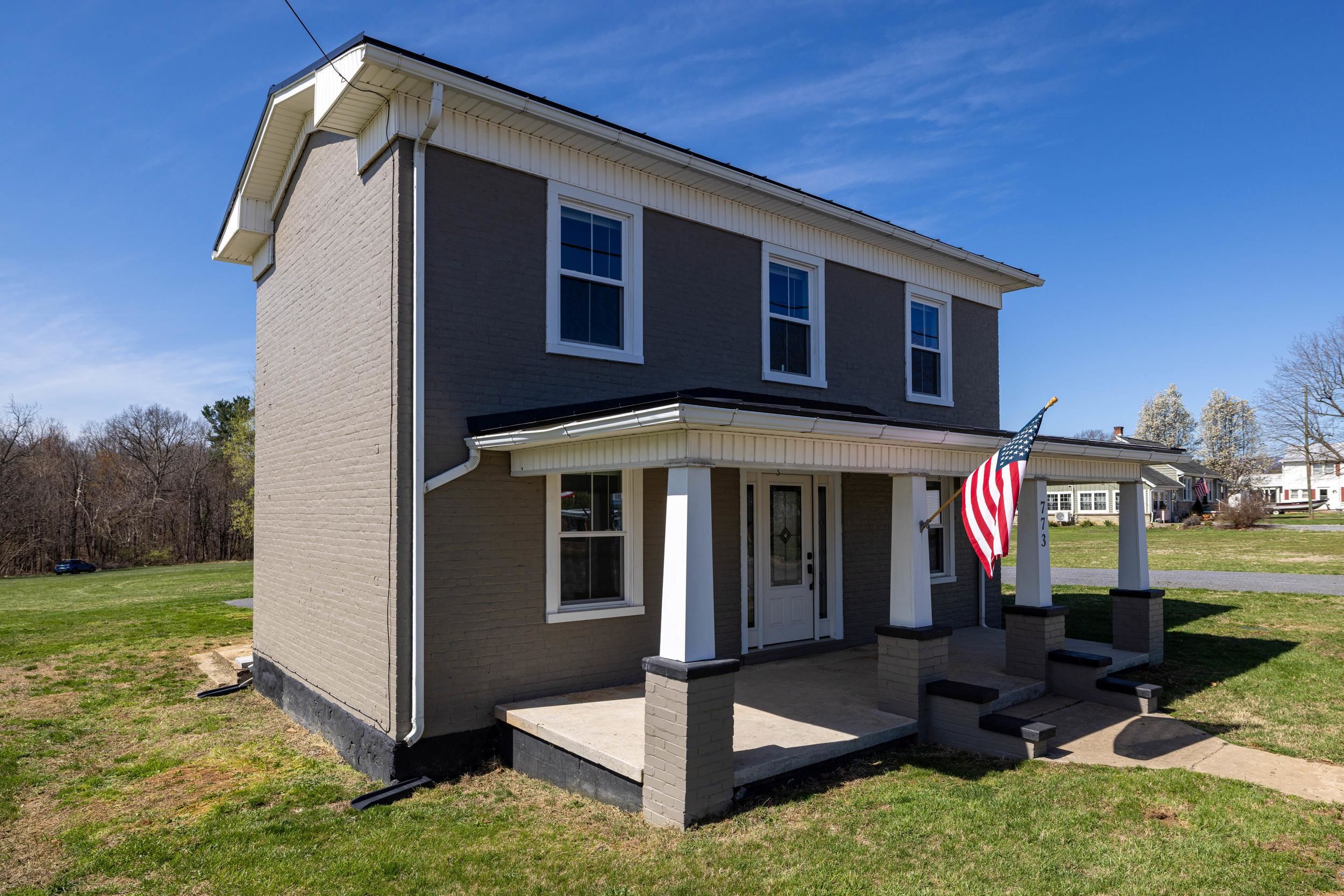 773 West Main Street Stanley, VA 22851 - Photo 37 of 66 a front view of a house with garden