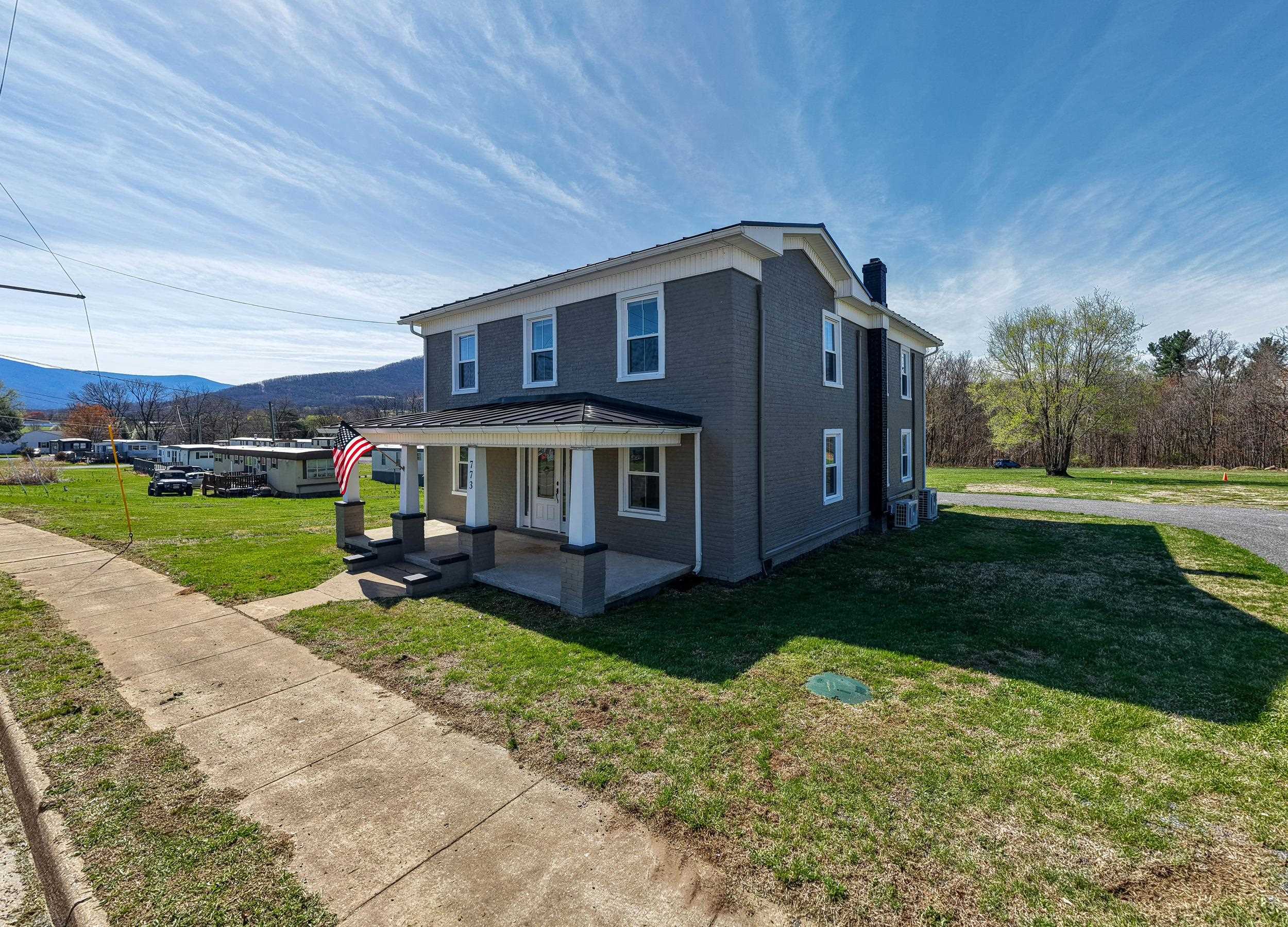773 West Main Street Stanley, VA 22851 - Photo 39 of 66 a view of a house with a yard porch and sitting area