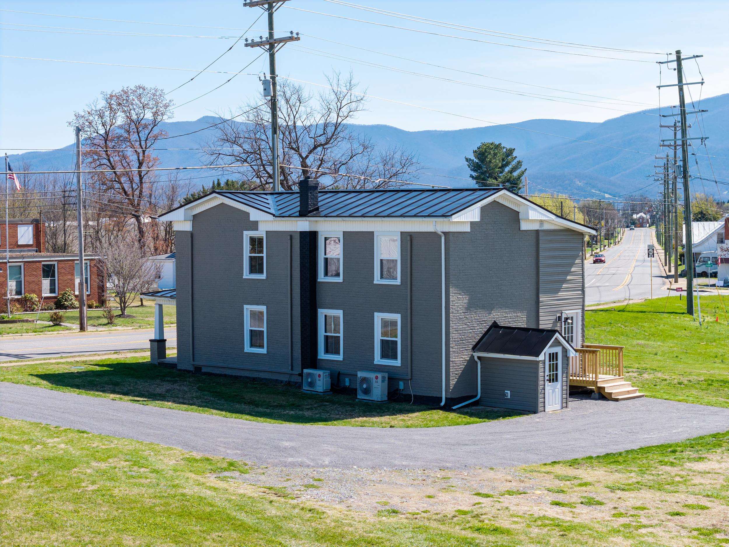 773 West Main Street Stanley, VA 22851 - Photo 42 of 66 a front view of a house with garden