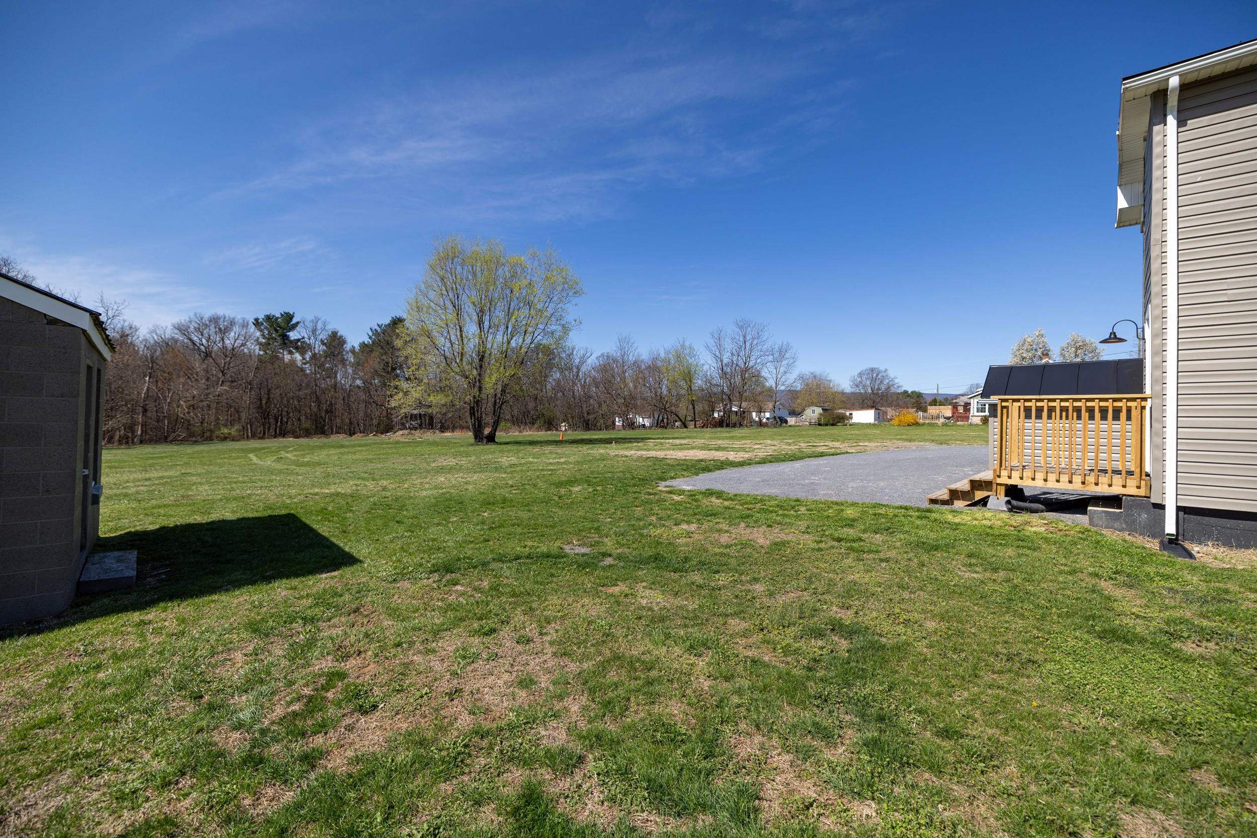 773 West Main Street Stanley, VA 22851 - Photo 46 of 66 a view of a garden with a building in the background