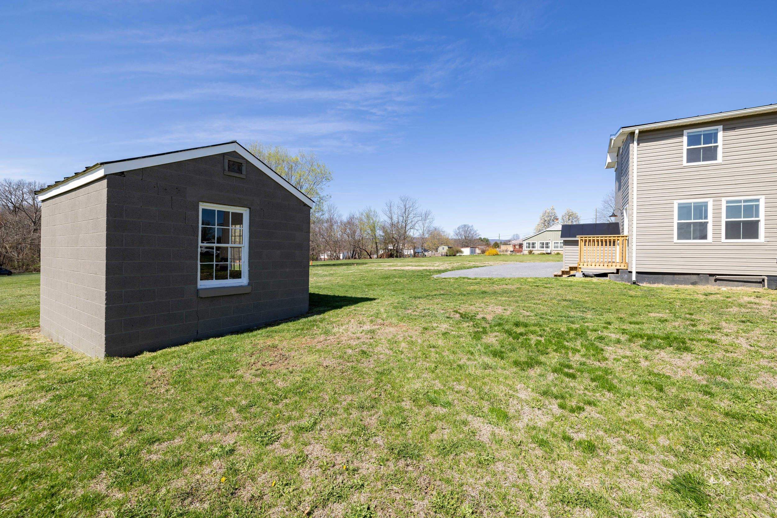 773 West Main Street Stanley, VA 22851 - Photo 47 of 66 a backyard of a house with lots of green space