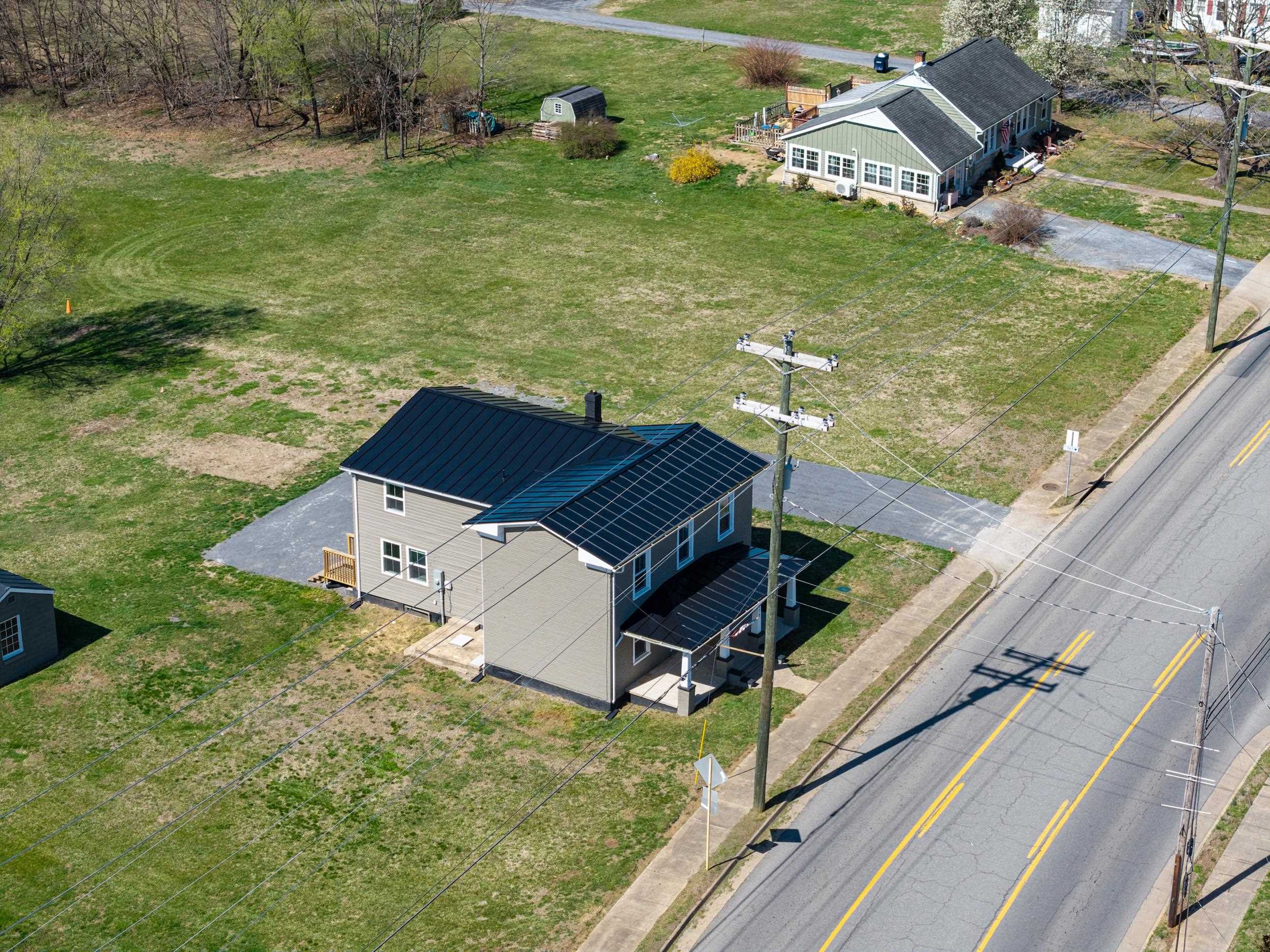 773 West Main Street Stanley, VA 22851 - Photo 51 of 66 a view of a pool with lawn chairs and a yard