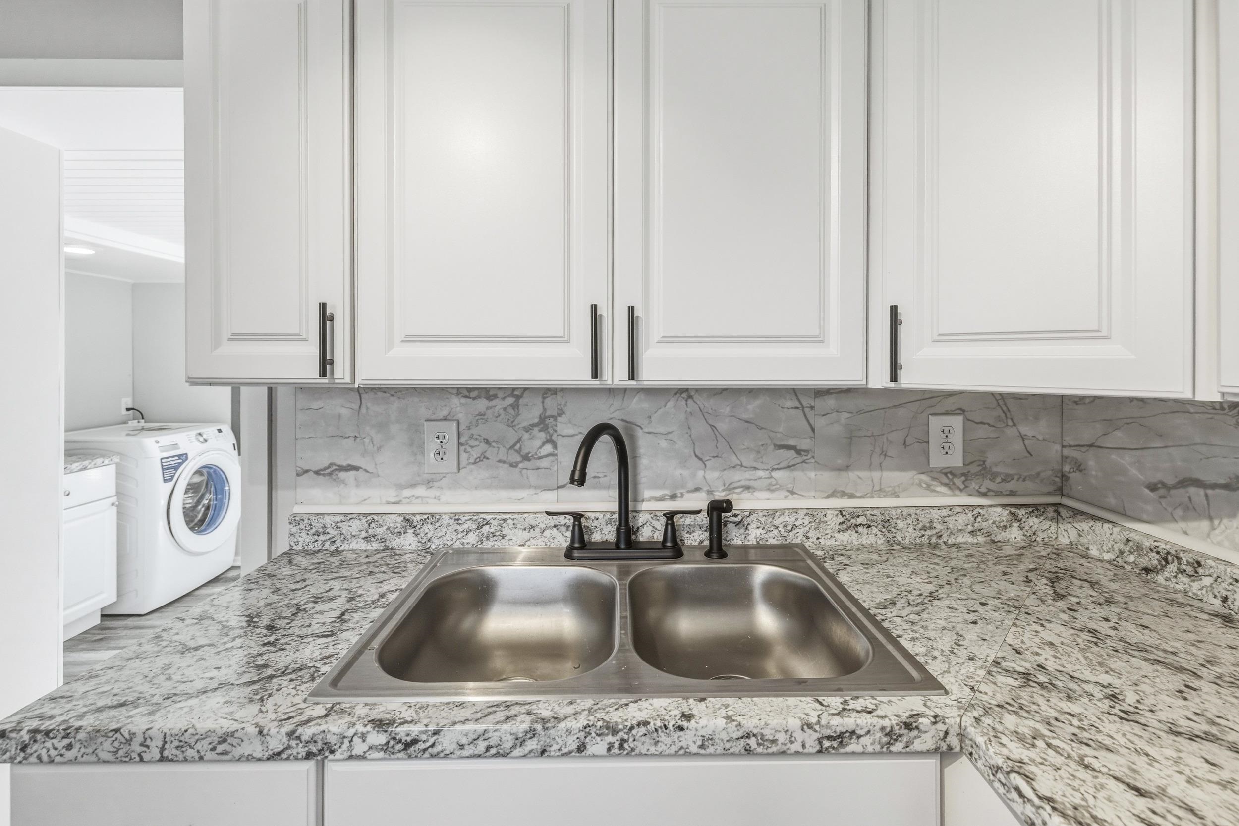 773 West Main Street Stanley, VA 22851 - Photo 7 of 66 a kitchen with granite countertop white cabinets and a sink