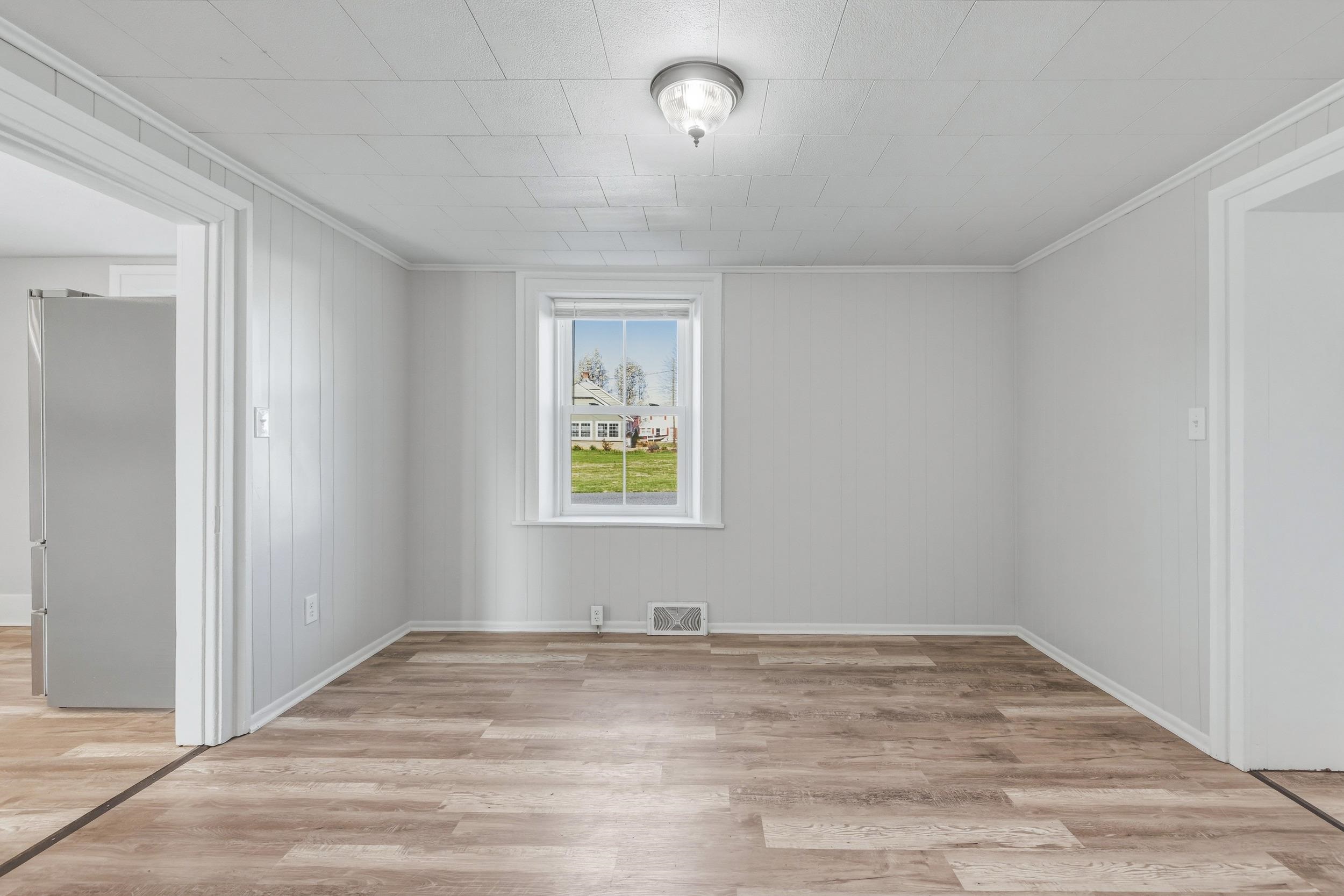 773 West Main Street Stanley, VA 22851 - Photo 10 of 66 a view of empty room with wooden floor
