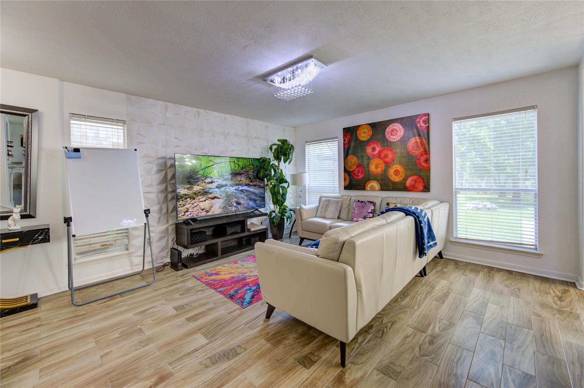 19334 Strathmore Pl Lane Katy, TX 77449 - Photo 12 of 48 a bed room with furniture and a flat screen tv